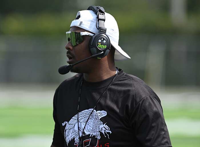 Buchtel football coach Bryan Williams works the sidelines in a game in 2022. Photo: Jeff Harwell